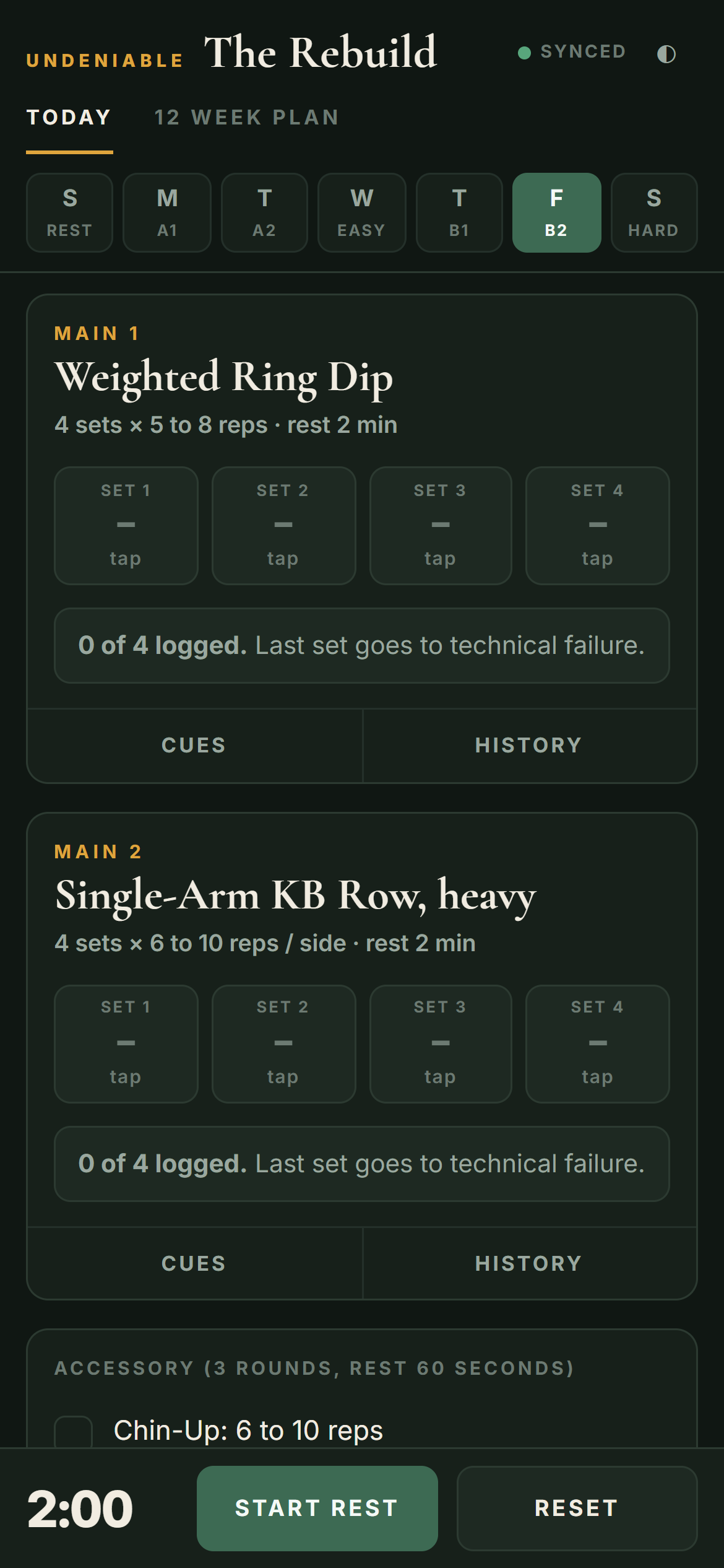 The training app on a phone, showing a logged set of ring dips and the prompt telling you whether to add weight